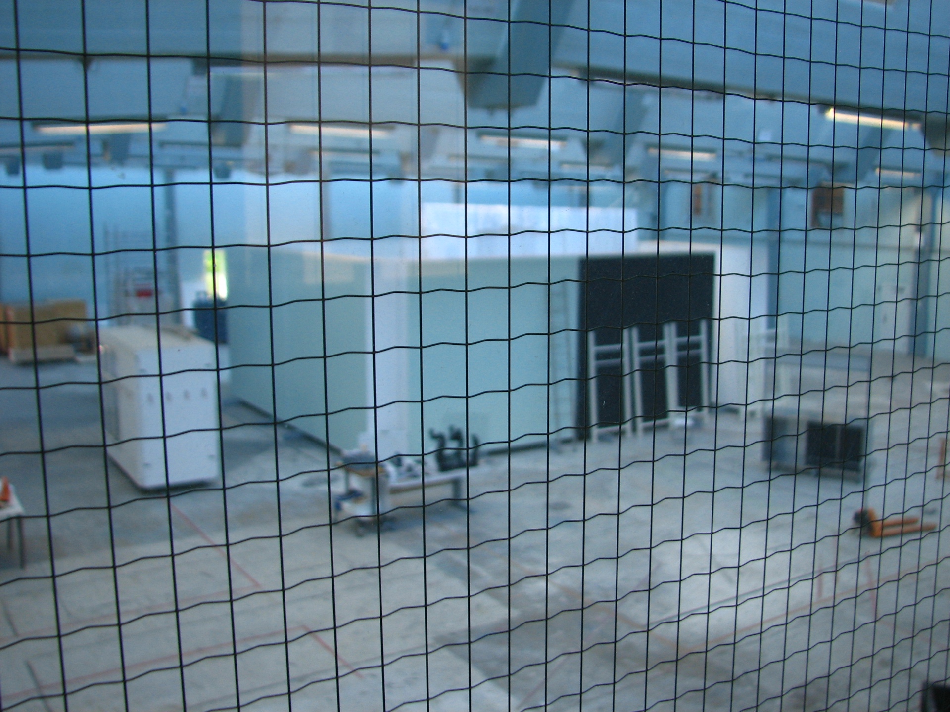View through wire mesh into FABRIKKEN's working hall